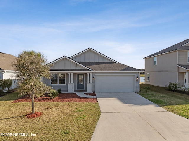 view of front facade featuring a shingled roof, a front lawn, concrete driveway, a garage, and board and batten siding