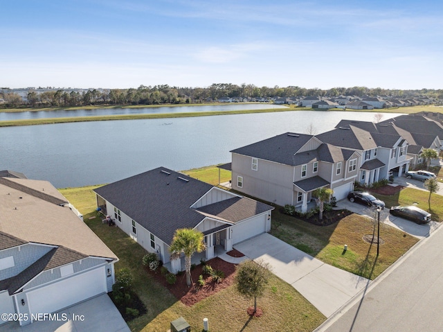 bird's eye view with a residential view and a water view