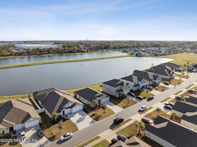 aerial view featuring a residential view and a water view