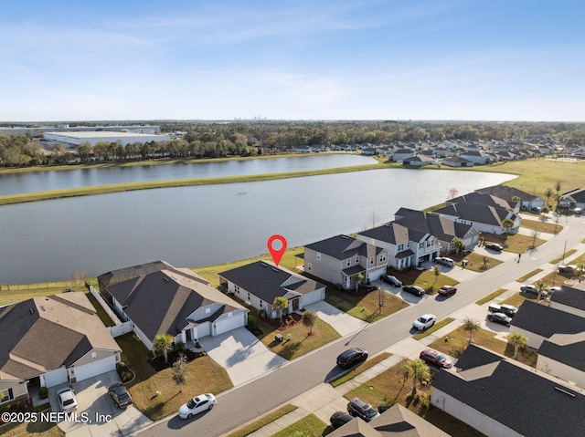 birds eye view of property featuring a residential view and a water view