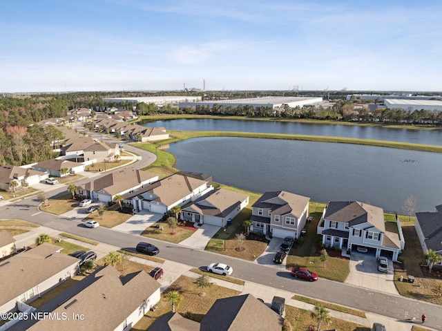 bird's eye view featuring a water view and a residential view