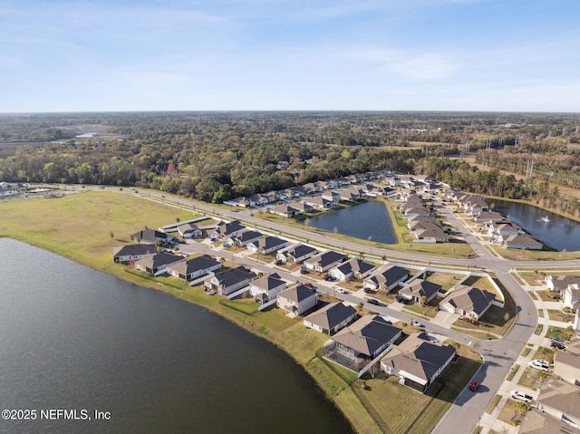 birds eye view of property featuring a residential view and a water view