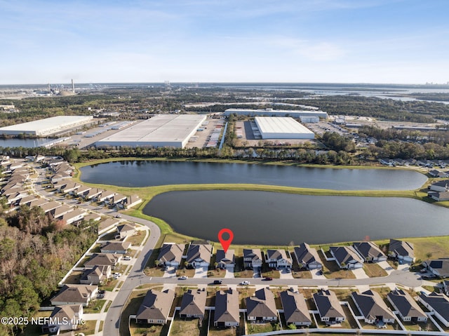 birds eye view of property with a water view and a residential view