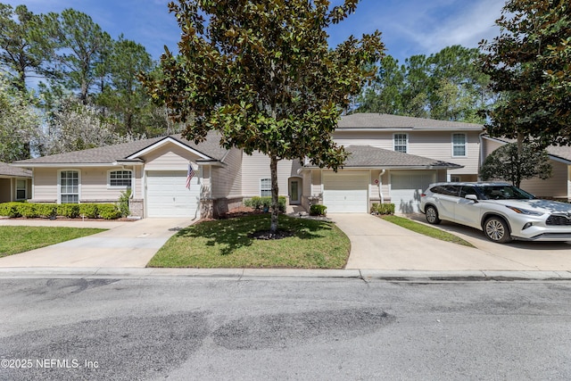 traditional-style house with concrete driveway, an attached garage, and a front lawn