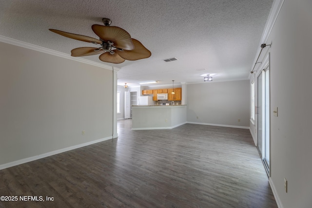 unfurnished living room featuring dark wood-style floors, visible vents, ceiling fan, and ornamental molding