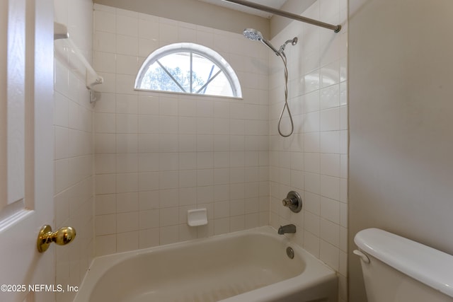 bathroom featuring toilet and shower / bath combination