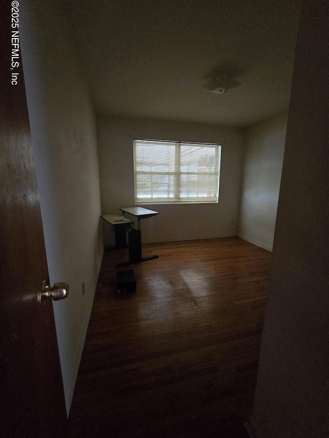 unfurnished room featuring wood finished floors