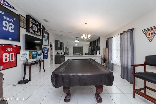 rec room with visible vents, billiards, a textured ceiling, an inviting chandelier, and light tile patterned floors