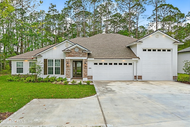 1646 County Road 315b, Green Cove Springs, FL 32043 - view of front of property with a garage, roof with shingles, concrete driveway, and a front yard