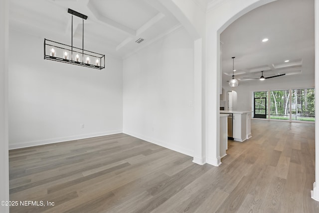 1646 County Road 315b, Green Cove Springs, FL 32043 - unfurnished dining area with ceiling fan with notable chandelier, baseboards, arched walkways, light wood-style floors, and visible vents