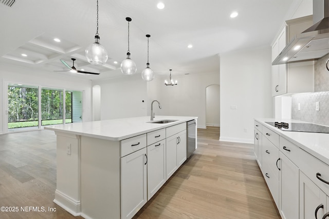 1646 County Road 315b, Green Cove Springs, FL 32043 - kitchen with recessed lighting, ceiling fan with notable chandelier, a sink, arched walkways, and wall chimney range hood