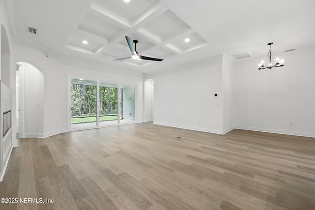 1646 County Road 315b, Green Cove Springs, FL 32043 - unfurnished living room featuring light wood-style flooring, arched walkways, ceiling fan with notable chandelier, and visible vents
