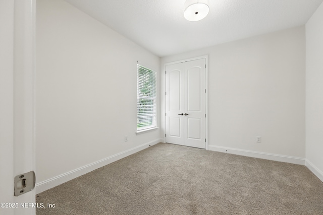 1646 County Road 315b, Green Cove Springs, FL 32043 - empty room featuring carpet flooring and baseboards