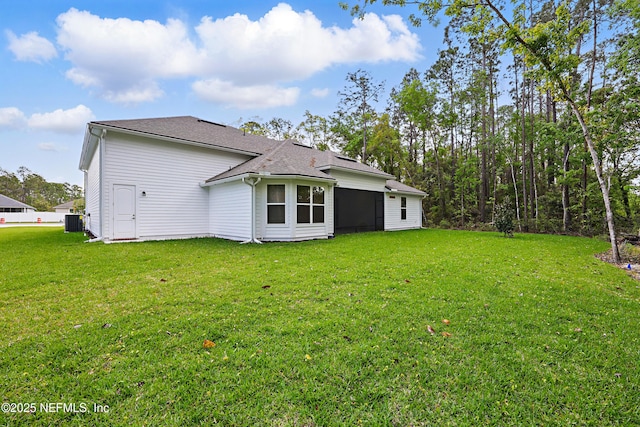 1646 County Road 315b, Green Cove Springs, FL 32043 - rear view of property with cooling unit, roof with shingles, and a yard