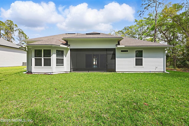 1646 County Road 315b, Green Cove Springs, FL 32043 - back of property featuring a sunroom, roof with shingles, and a lawn