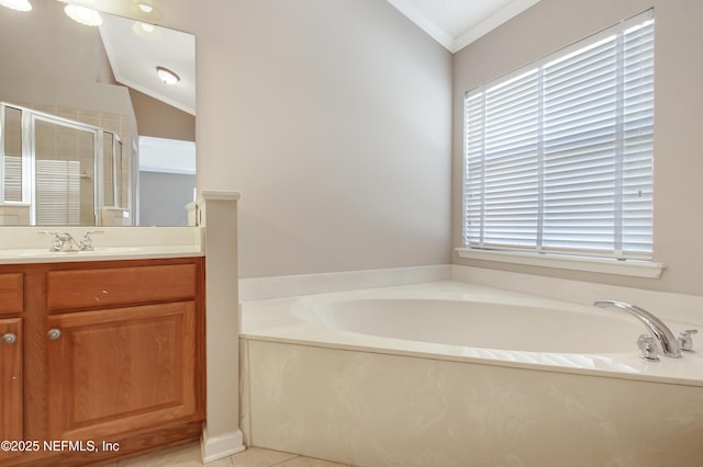 bathroom featuring crown molding, vaulted ceiling, a stall shower, a bath, and vanity