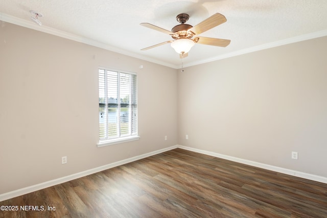 empty room featuring ceiling fan, wood finished floors, baseboards, and ornamental molding