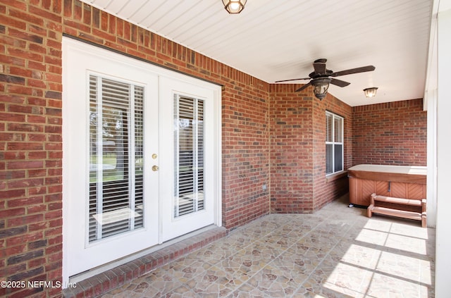 view of patio with french doors, an indoor hot tub, and ceiling fan