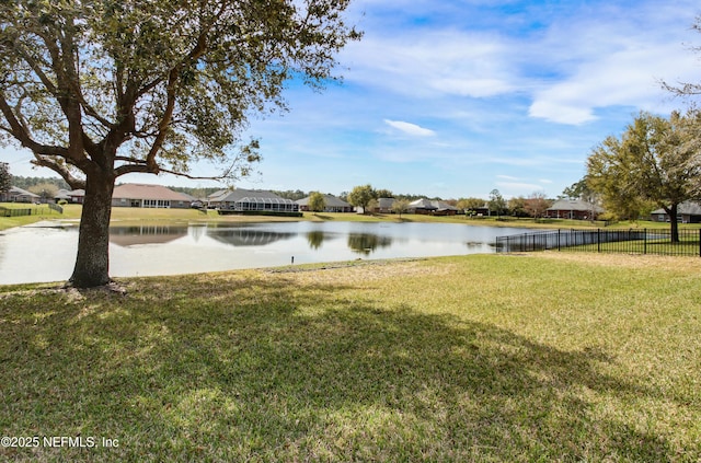 view of water feature with fence