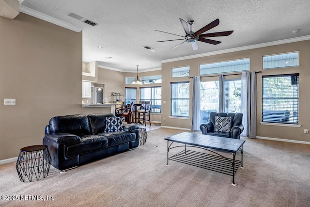 living room featuring visible vents, light carpet, ceiling fan, and ornamental molding