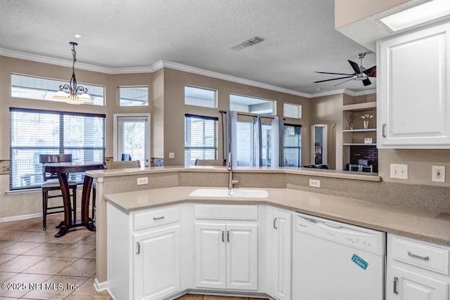 kitchen with a sink, visible vents, plenty of natural light, and dishwasher