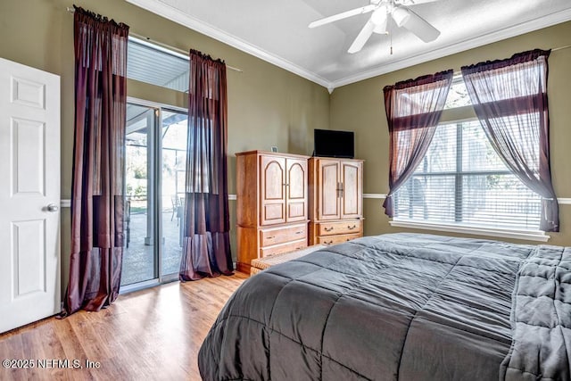 bedroom with light wood-style flooring, multiple windows, ornamental molding, and access to outside