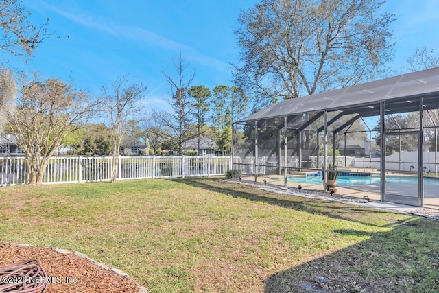 view of yard with a lanai, a fenced in pool, and a fenced backyard