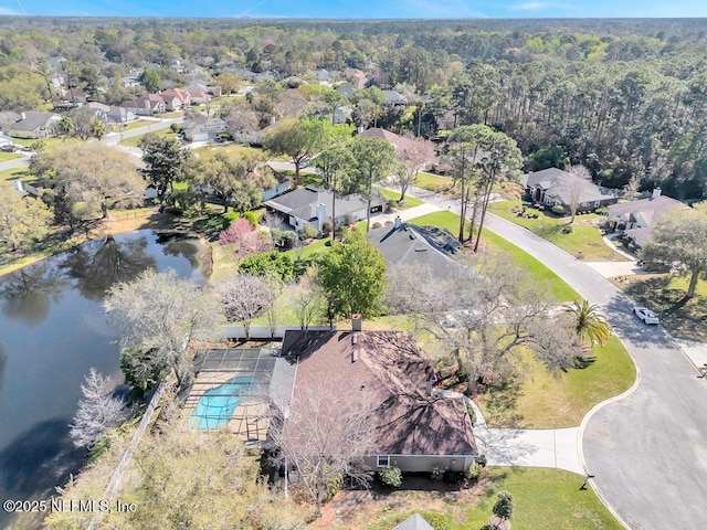 birds eye view of property featuring a residential view and a water view