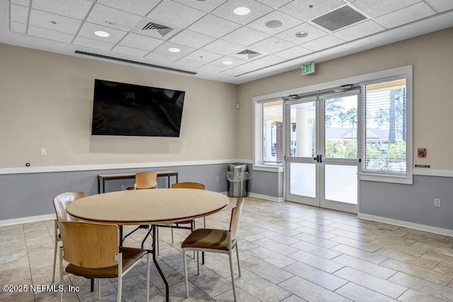 dining room with french doors, visible vents, and baseboards