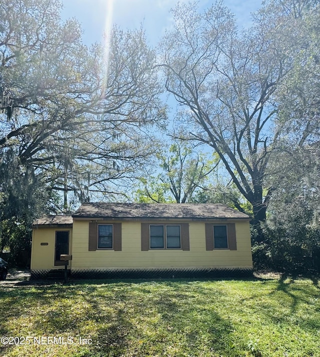 view of home's exterior featuring a lawn