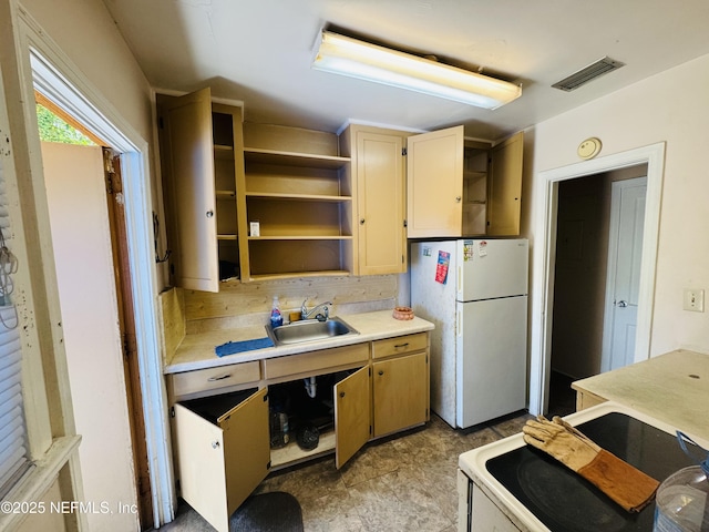 kitchen with white appliances, visible vents, open shelves, a sink, and light countertops