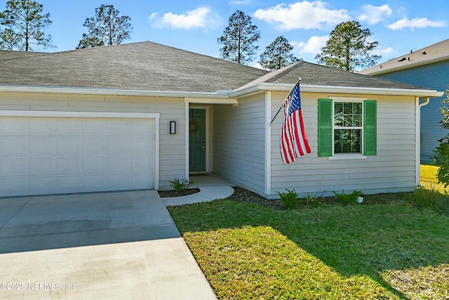 single story home featuring an attached garage, concrete driveway, a front lawn, and a shingled roof