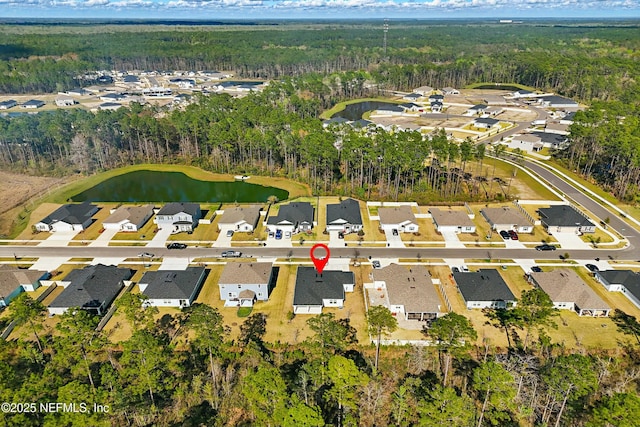 birds eye view of property featuring a forest view, a water view, a residential view, and golf course view