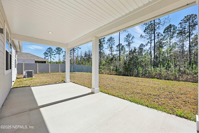 view of patio / terrace featuring cooling unit and fence