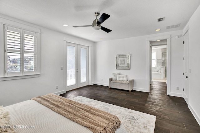 bedroom with visible vents, baseboards, dark wood-style flooring, and access to outside