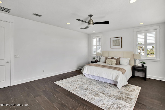 bedroom featuring recessed lighting, visible vents, baseboards, and dark wood finished floors