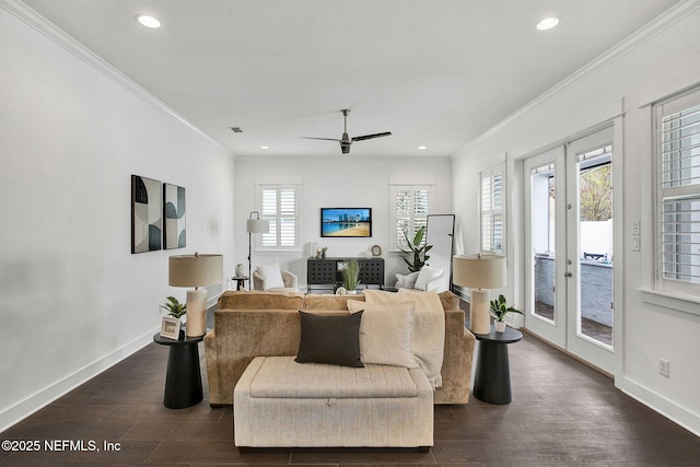 living area featuring ceiling fan, baseboards, dark wood finished floors, ornamental molding, and french doors