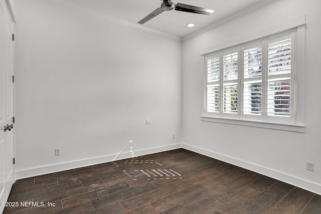 spare room featuring dark wood finished floors, baseboards, ceiling fan, and ornamental molding