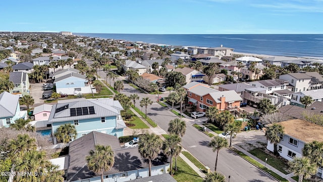 drone / aerial view with a residential view and a water view