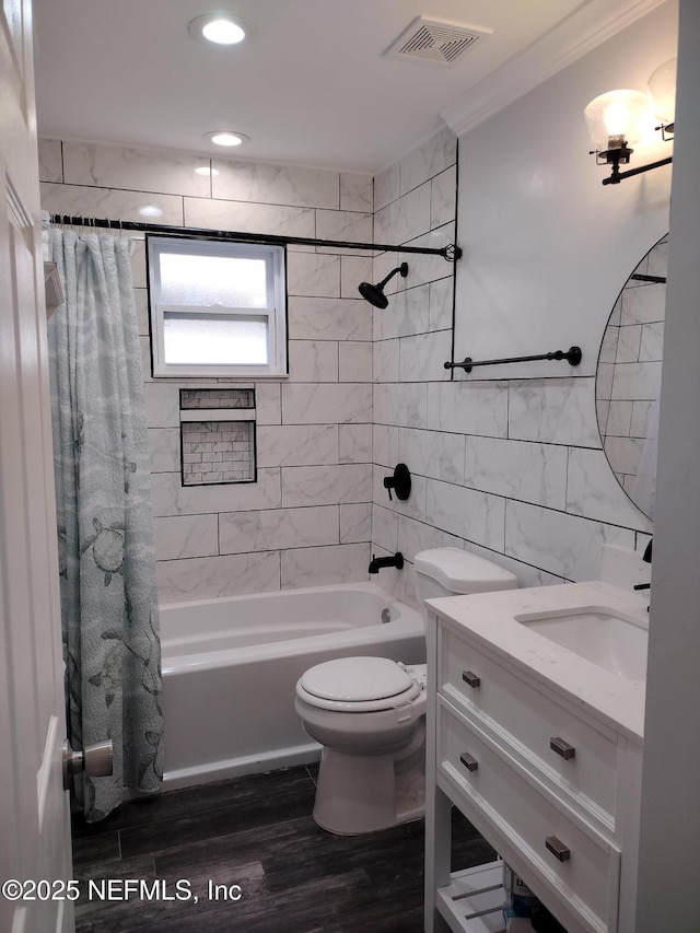 full bathroom featuring visible vents, shower / bath combination with curtain, crown molding, tile walls, and toilet