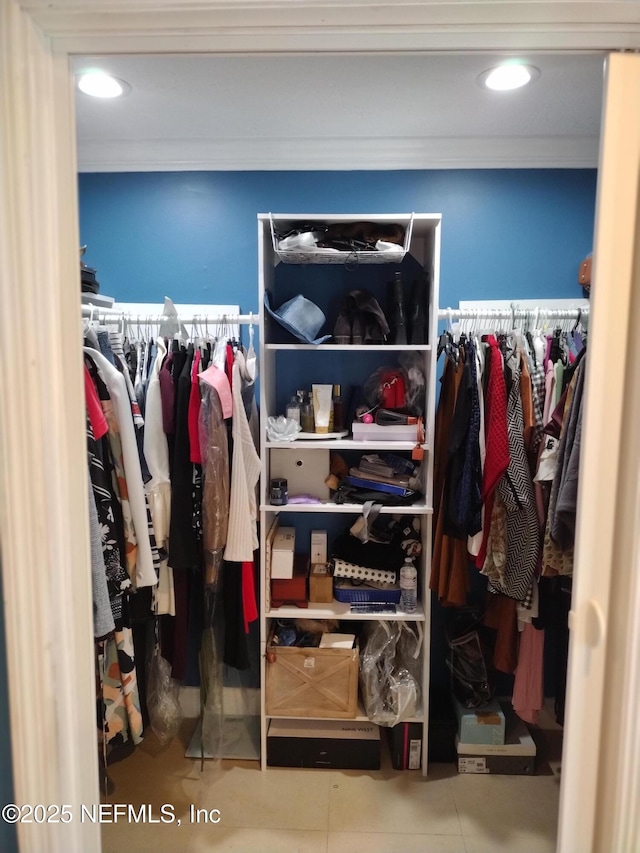 spacious closet featuring tile patterned flooring