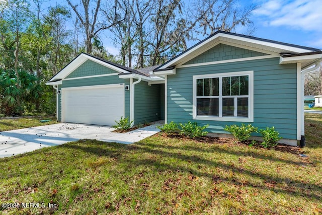 single story home featuring a front lawn, a garage, and driveway