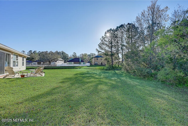 view of yard with a patio and fence