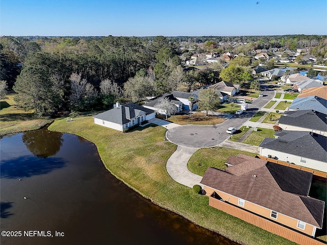 drone / aerial view with a residential view and a water view