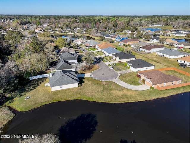 birds eye view of property featuring a residential view and a water view