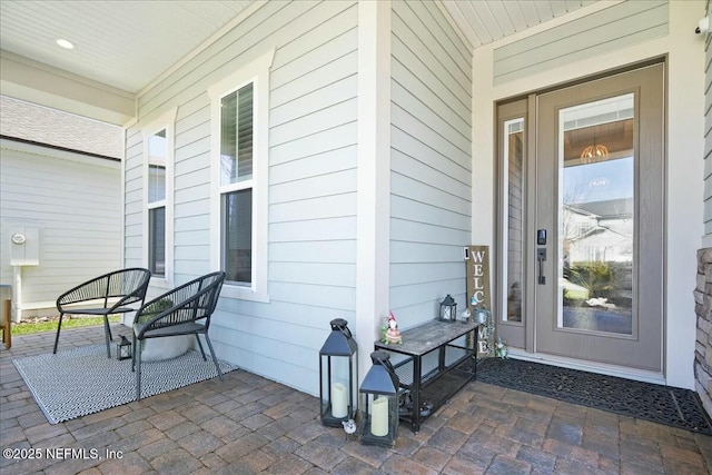 property entrance featuring a porch