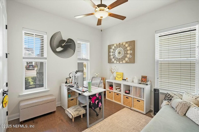 home office featuring baseboards, wood finished floors, and a ceiling fan