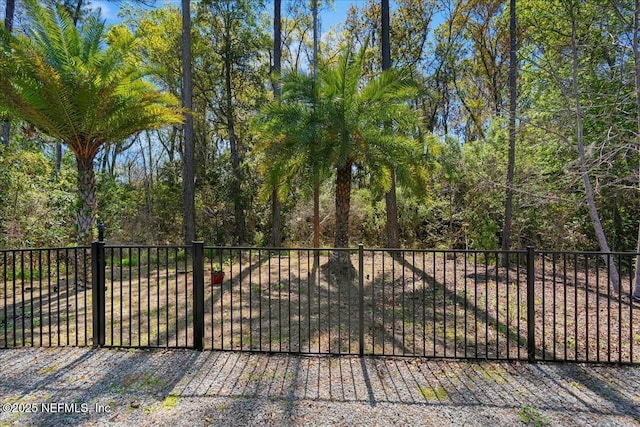 view of gate with fence