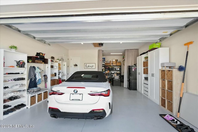 garage with freestanding refrigerator