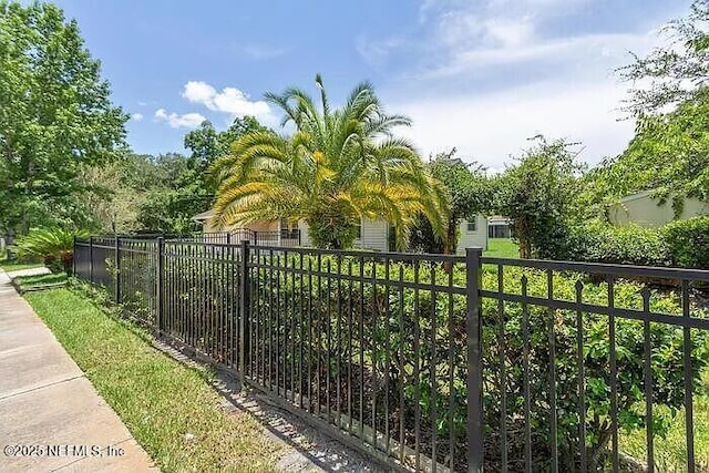 view of gate featuring fence